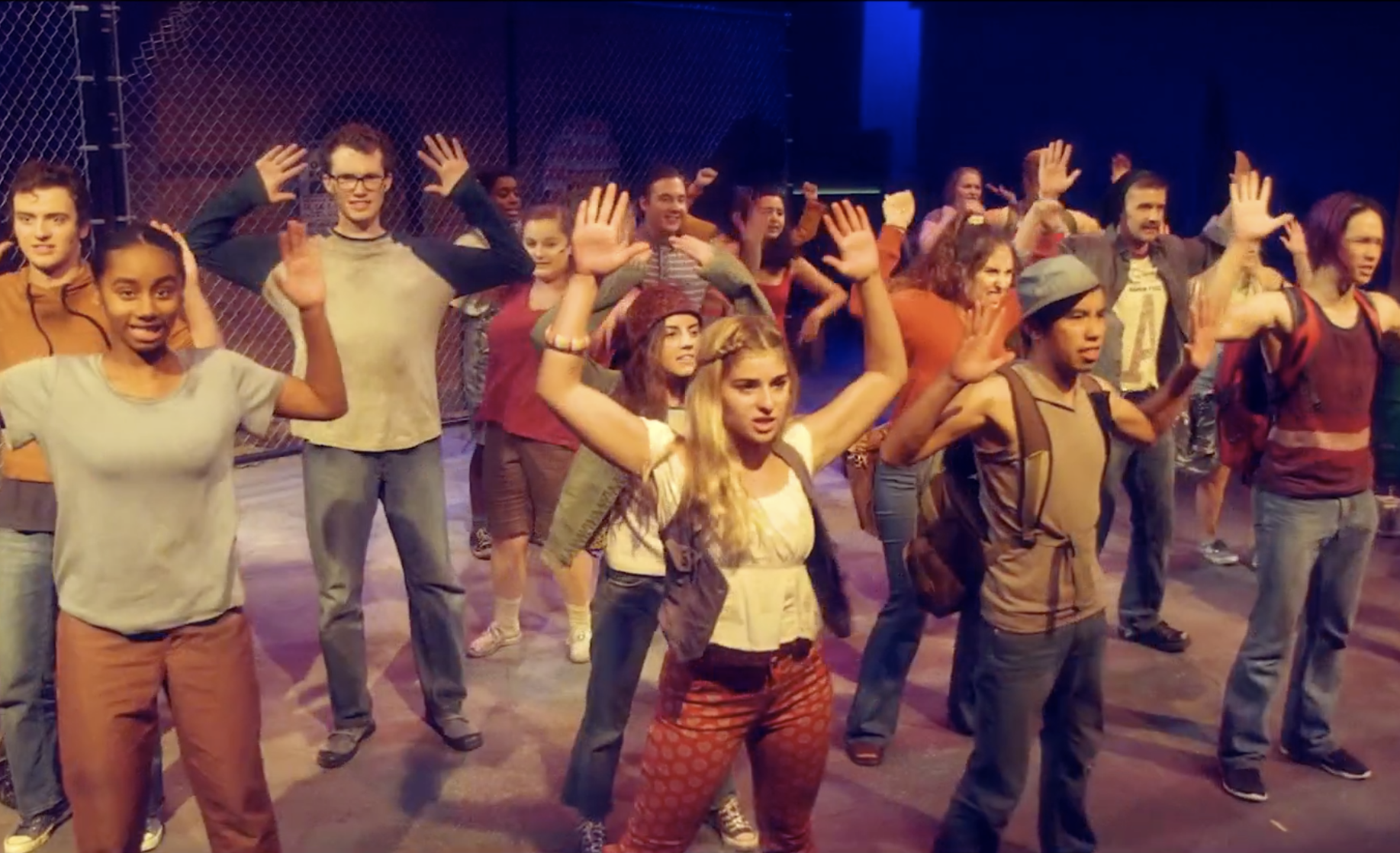 group of students performing on stage